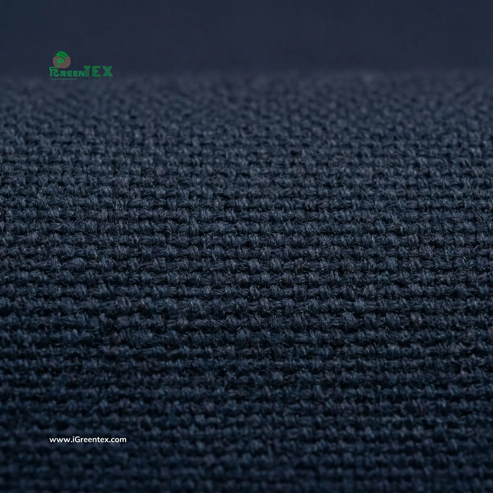A macro photograph of the thick weave and sturdy texture of kate ford fabric at iGreen Tex Vietnam. The image highlights the heavy-duty workwear construction, designed for high-durability uniforms and industrial clothing export.