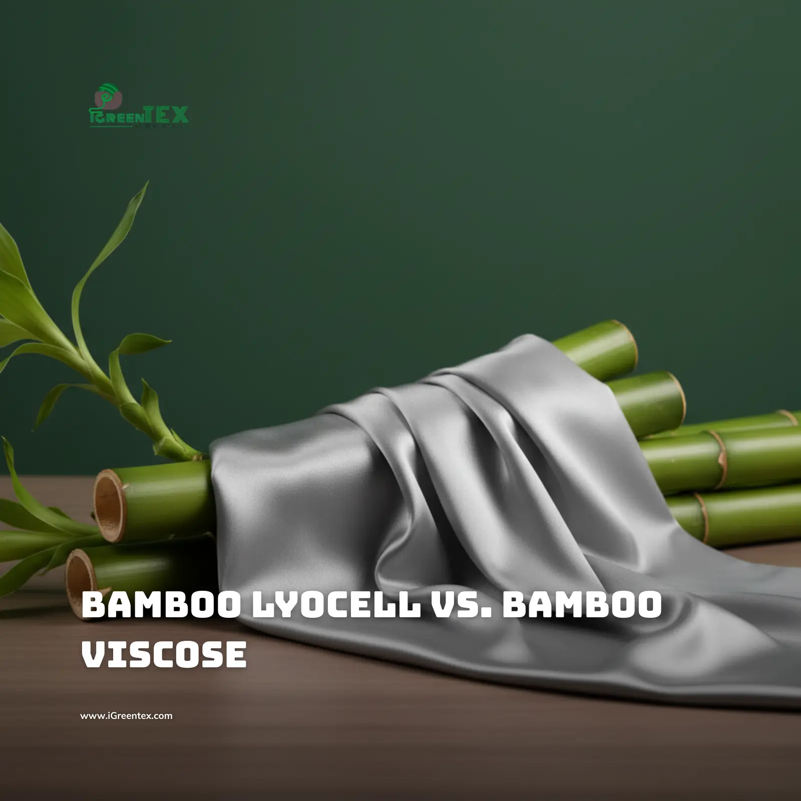 Close-up of silver-grey Bamboo Lyocell fabric draping over fresh green bamboo stalks. The fabric looks soft and fluid, set against a professional deep forest green background by iGreen Tex.