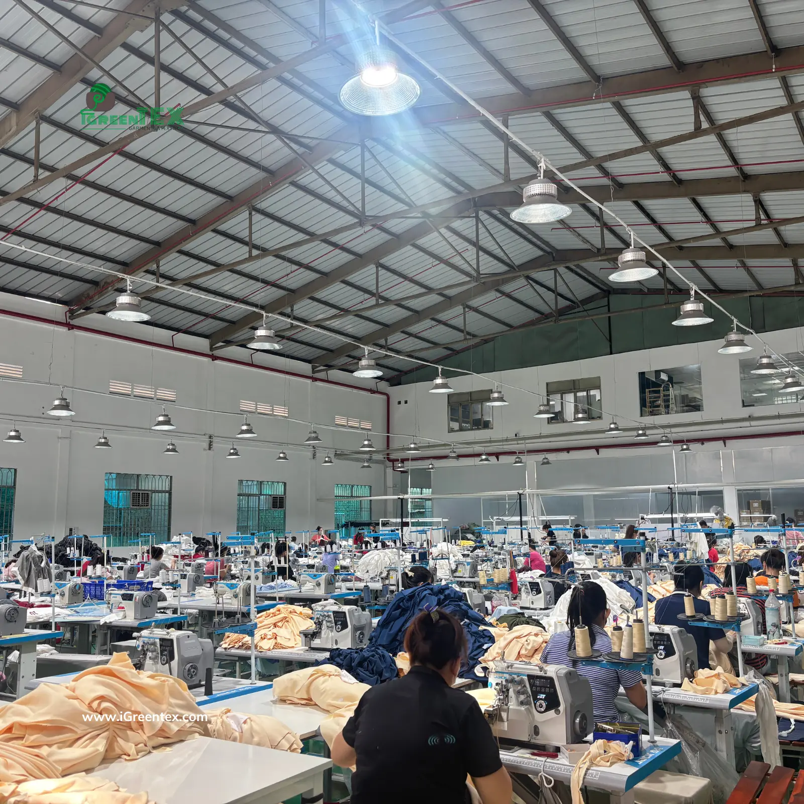 The professional production floor at iGreen Tex in Vietnam, demonstrating why the Vietnam vs China manufacturing cost is a key factor for global brands. This image shows our high-capacity garment manufacturing lines and skilled workforce.