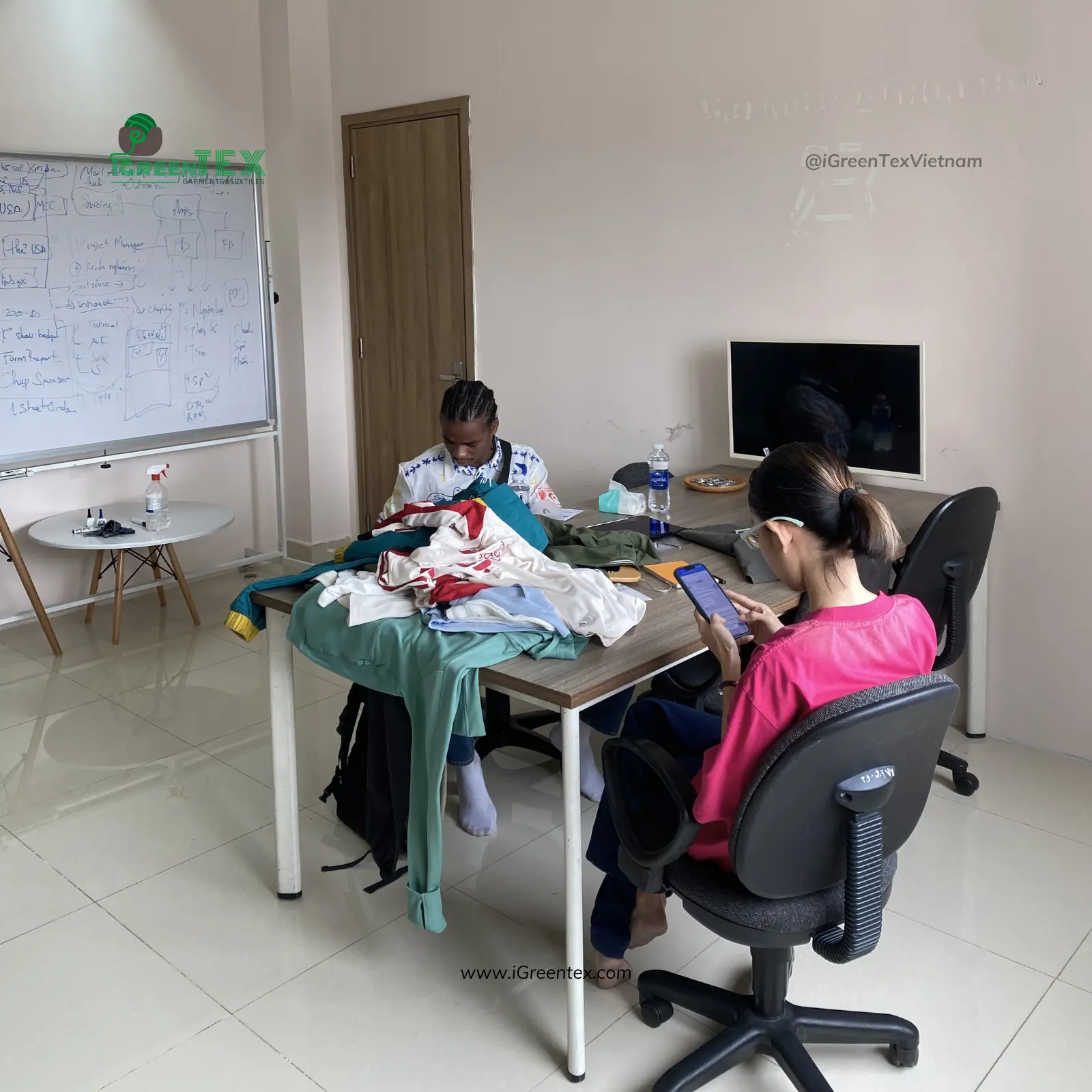 Quality inspectors reviewing export standards within the garment industry in Vietnam frameworks.