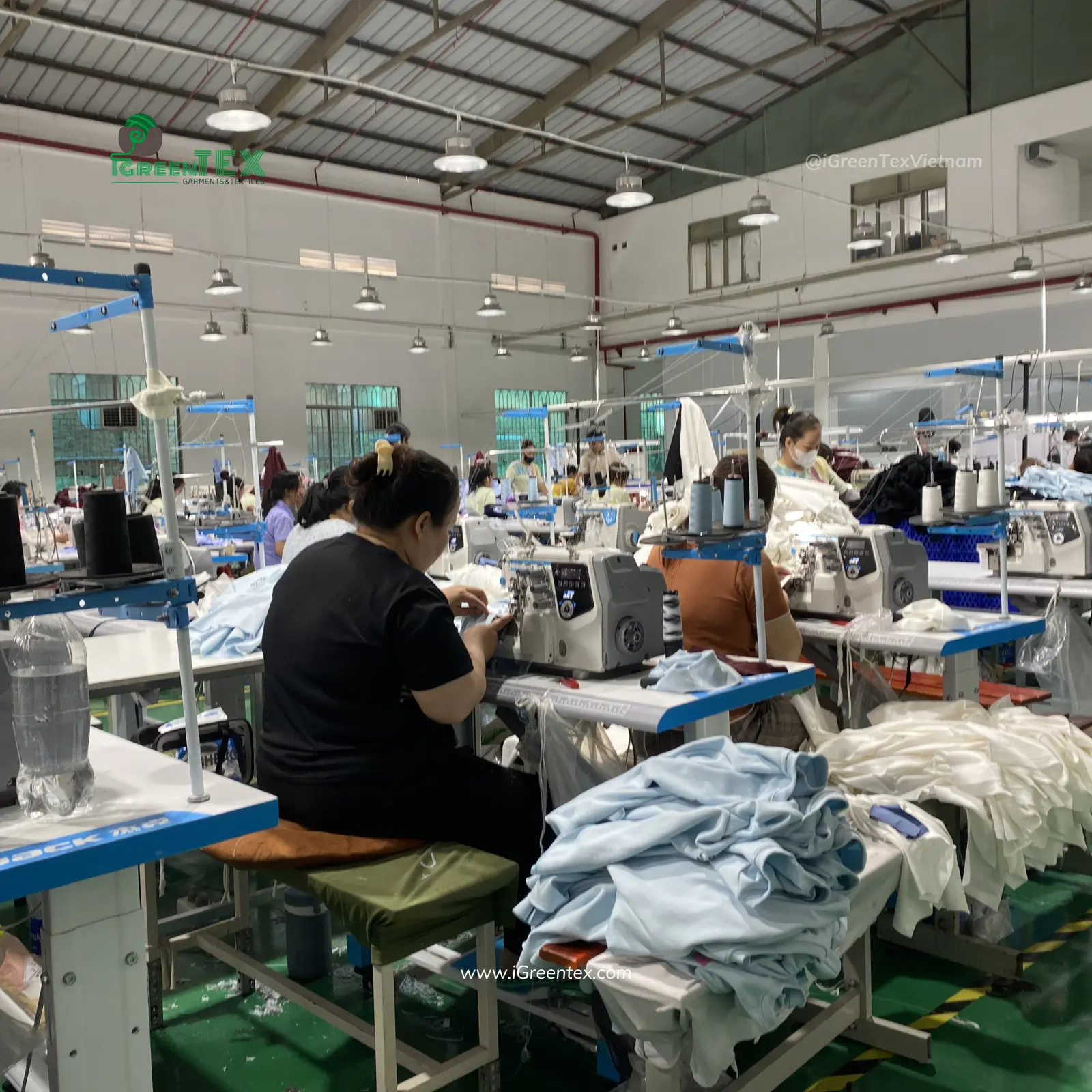 Experienced operators handling complex stitching showing why manufacture apparel in Vietnam.