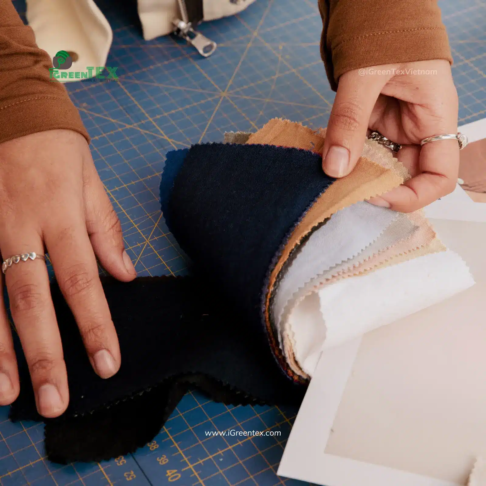 Fabric swatches and raw textile rolls inspected for the clothing production process.