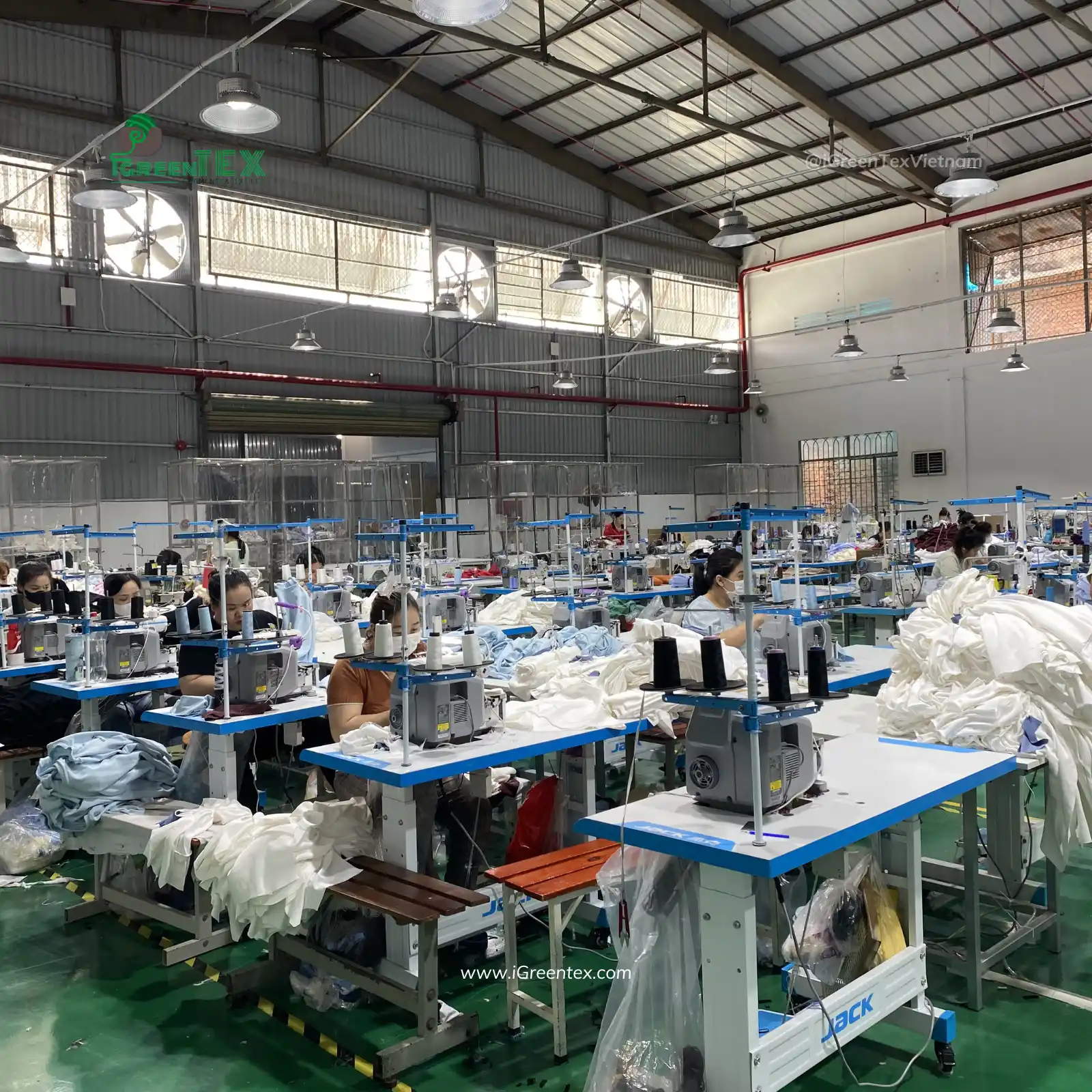 Active assembly lines running high volume orders inside clothing production process.
