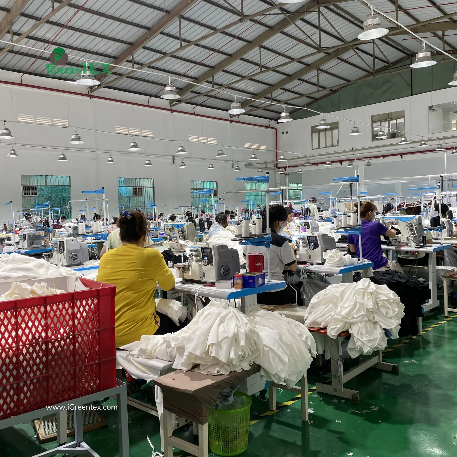 Skilled tailors at iGreen Tex Vietnam operating as a specialized boutique clothing manufacturer for emerging brands.