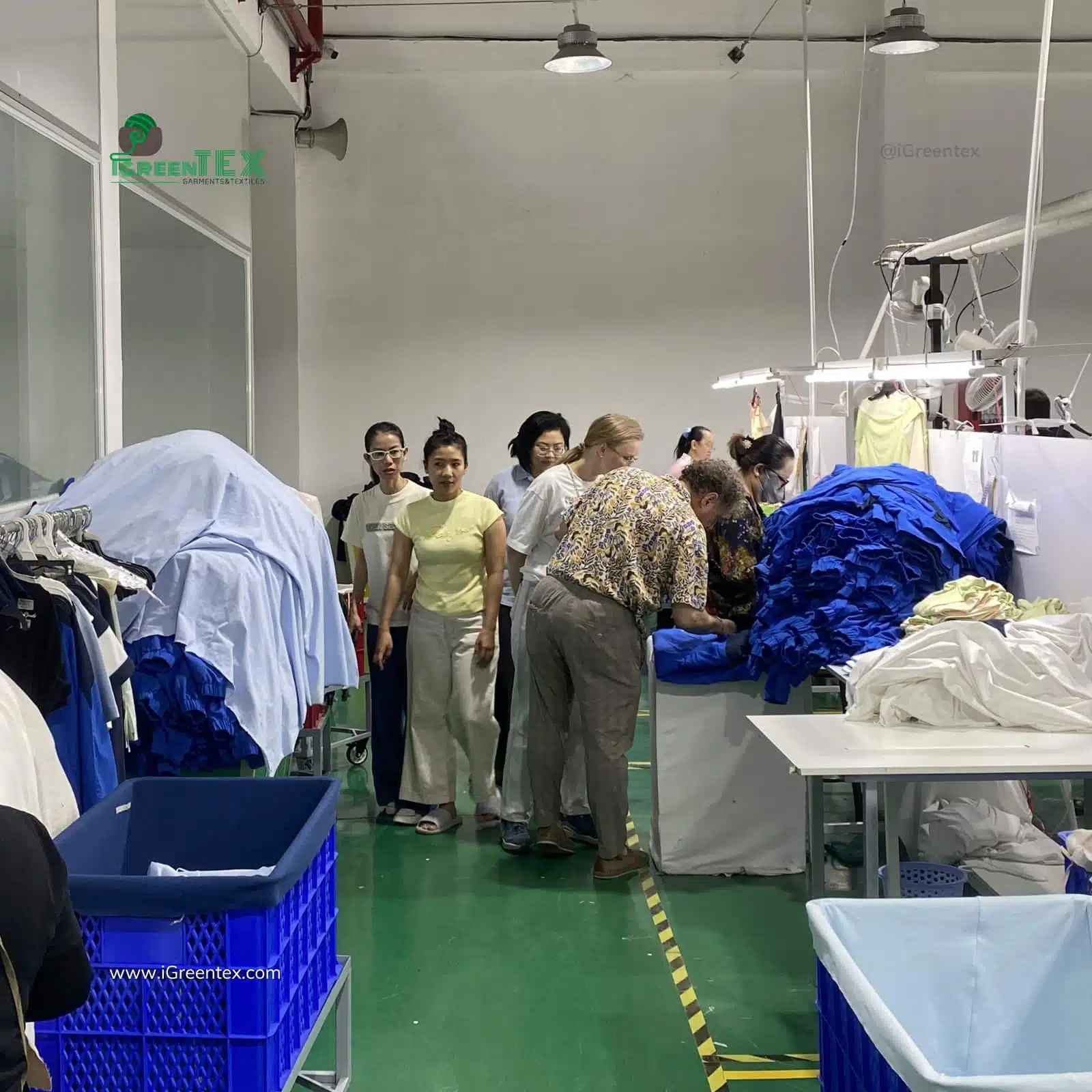 iGreen Tex Vietnam team guiding a US client through a factory audit to verify a clothing manufacturer in Vietnam.